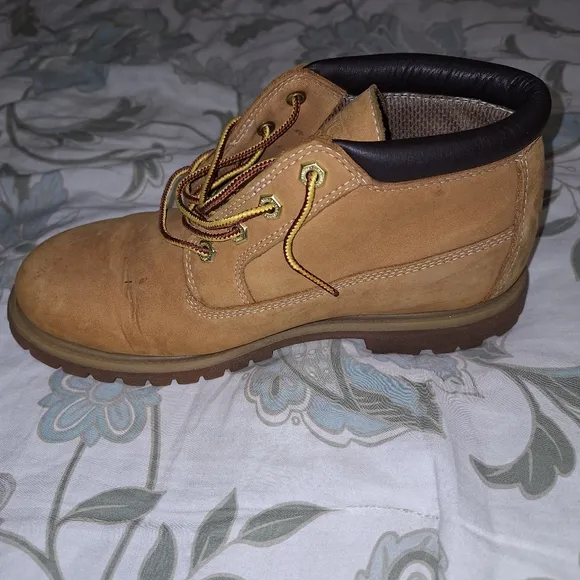 A pair of Timberland Waterproof ladies 9.5W tan leather boots. Pre-loved