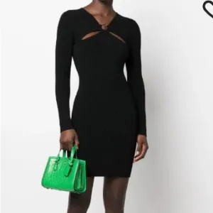 MICHEAL KORS size small black ribbed long sleeve sweater dress with cut outs