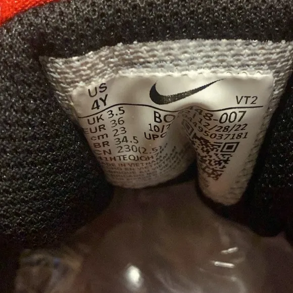 Nike kids black and red sneakers