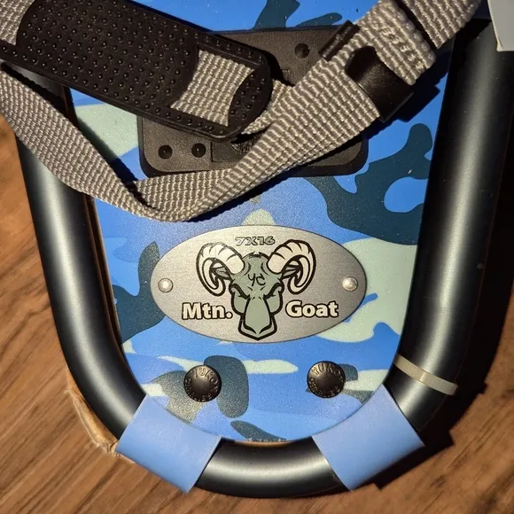 NWT. Youth size snow shoes size 7x16. Yukon Charlie's blue camouflage snowshoe
