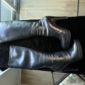 Prada leather heel boots in pristine condition