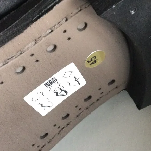 Wing tip dress boot