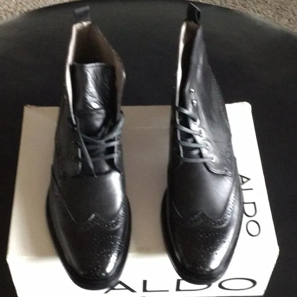 Wing tip dress boot